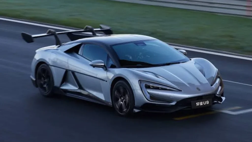 A silver high-performance BYD electric sports car speeding on a track, representing cutting-edge technology from the Best EV brands.