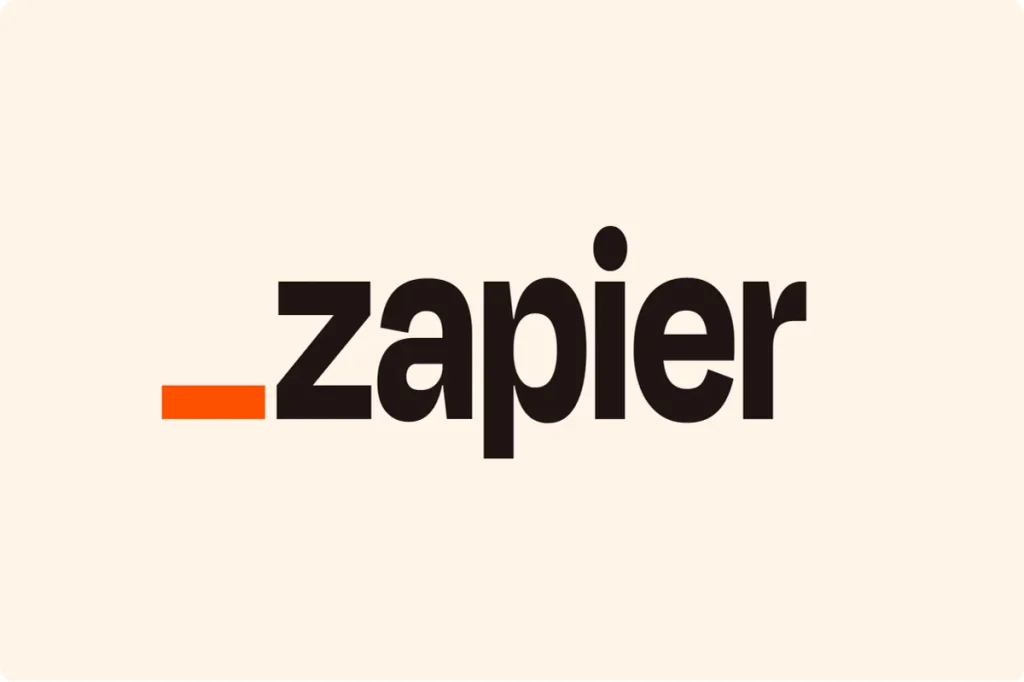 The Zapier logo, consisting of a solid orange rectangle next to the word "_zapier" in a bold, lowercase black font on a beige background.